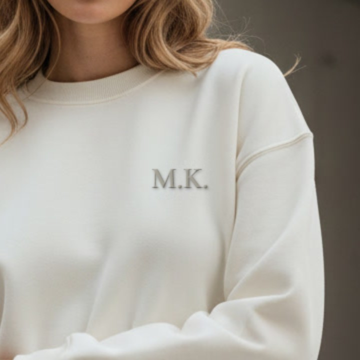 Off-white sweatshirt with tone-on-tone embroidered initials M.K.